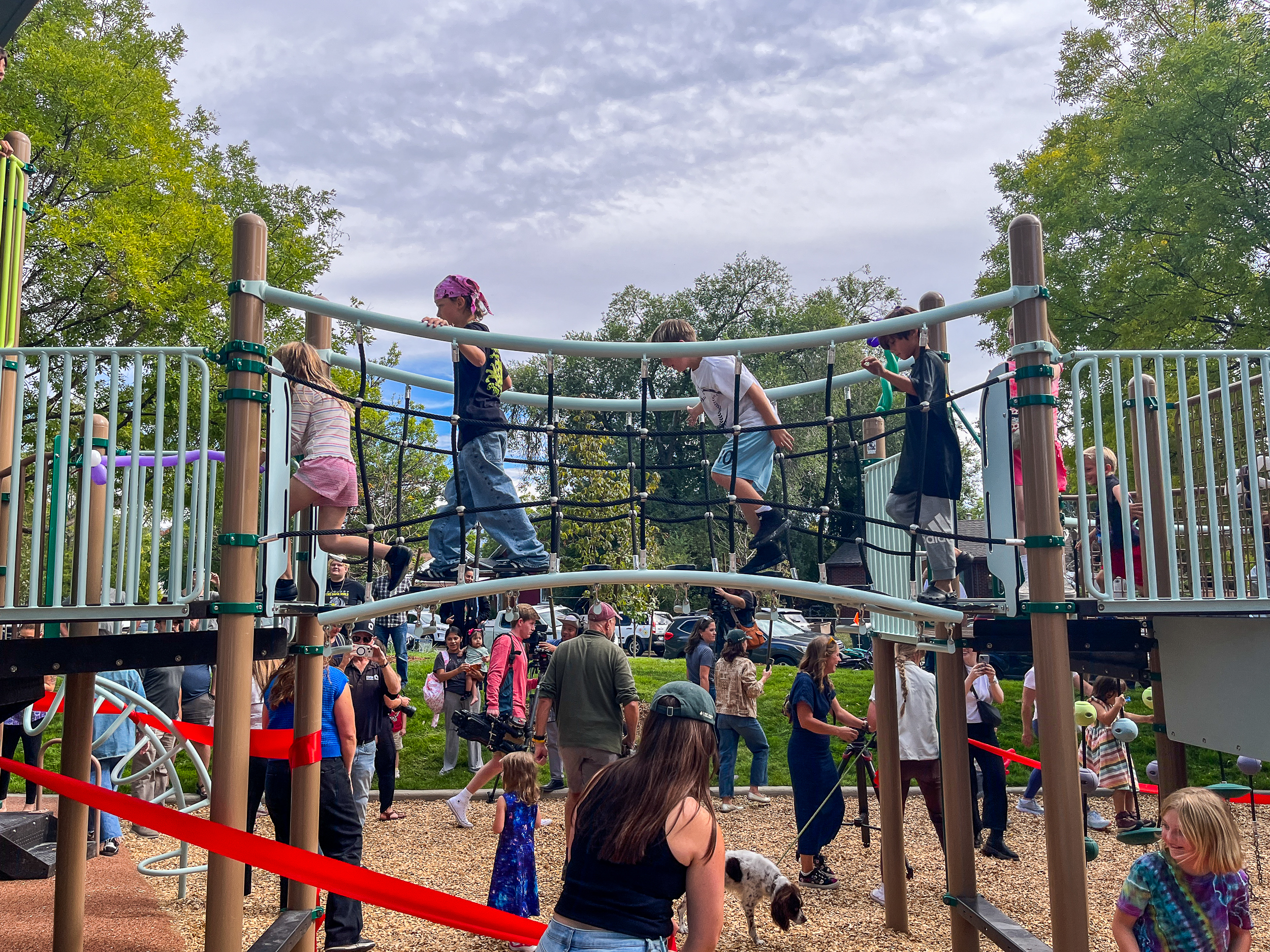Children test the new play equipment at Joseph F. Steenblik Park on Monday.