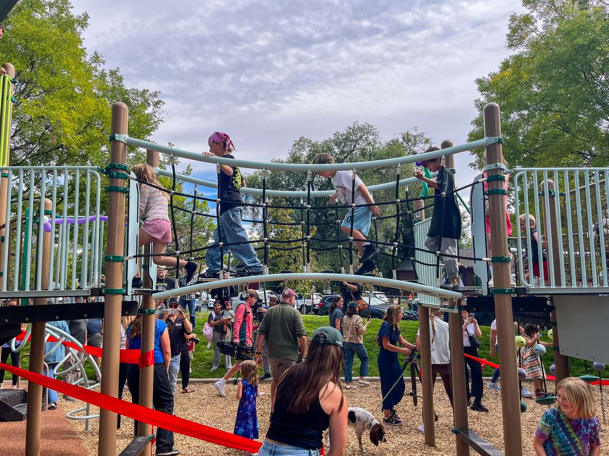 Children test the new play equipment at Joseph F. Steenblik Park on Monday.