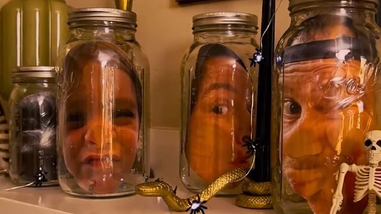 Creative Halloween decorations created using mason jars and printed photos.