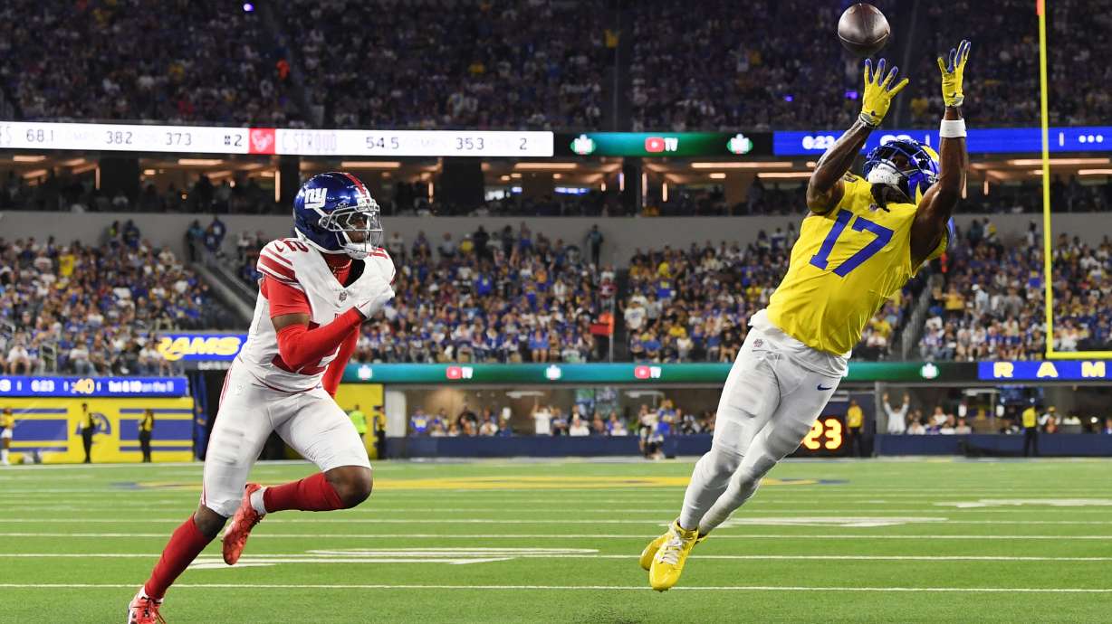 Los Angeles Rams wide receiver Davante Adams (17) makes a touchdown catch past New York Giants cornerback Colton Hood (12) during the second half of an NFL football game in Inglewood, Calif., Monday, Sept. 21, 2026.