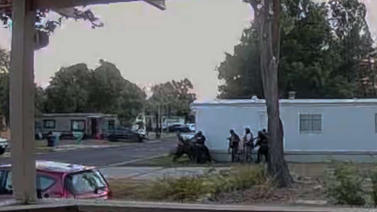 Doorbell camera footage shows law enforcement engaged in a standoff with suspect Jorge Andrade in June 2025.