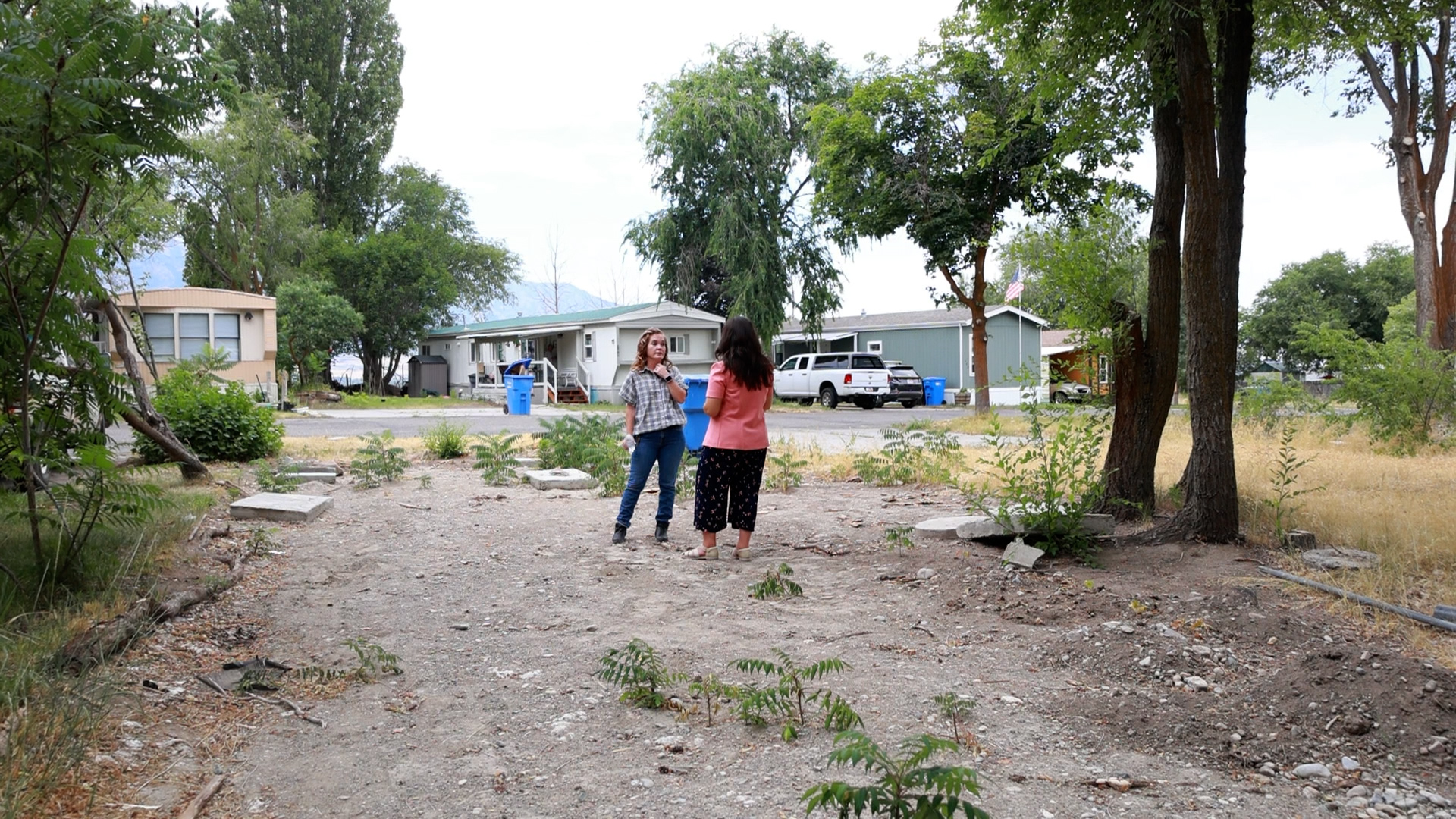 RaeAnn Bott speaks with the KSL Investigators at the plot where her home used to be.