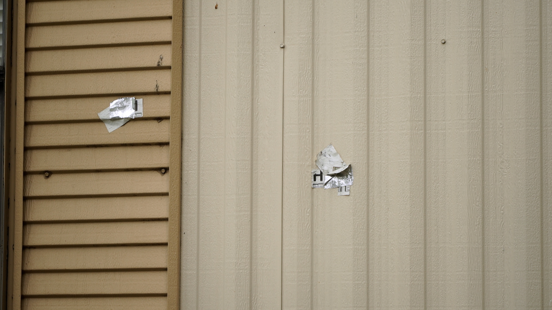 Bullet holes and evidence markers remain visible more than a year after the deadly incident.