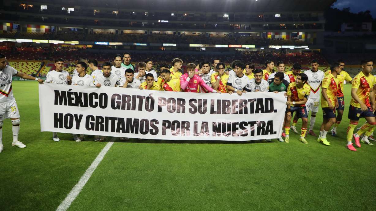 Players of Atletico Morelia and Leones Negros hold a sign that reads, "Mexico shouted for its freedom. Today, we shout for ours," before a Mexican second-division soccer match in Morelia, Michoacan state, Mexico, Saturday, Sept. 19, 2026.