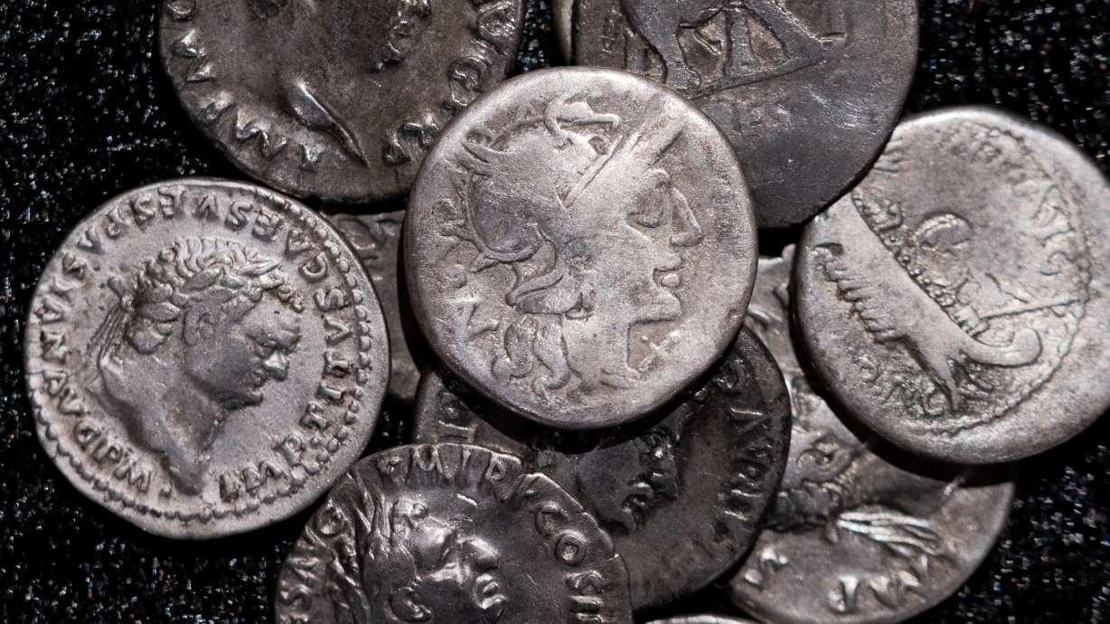 Roman coins, including the one coin, centre, dating from 148 B.C., when Rome was still a republic without an emperor, are on display at the LVR State Museum, in Bonn, Germany, on Tuesday.