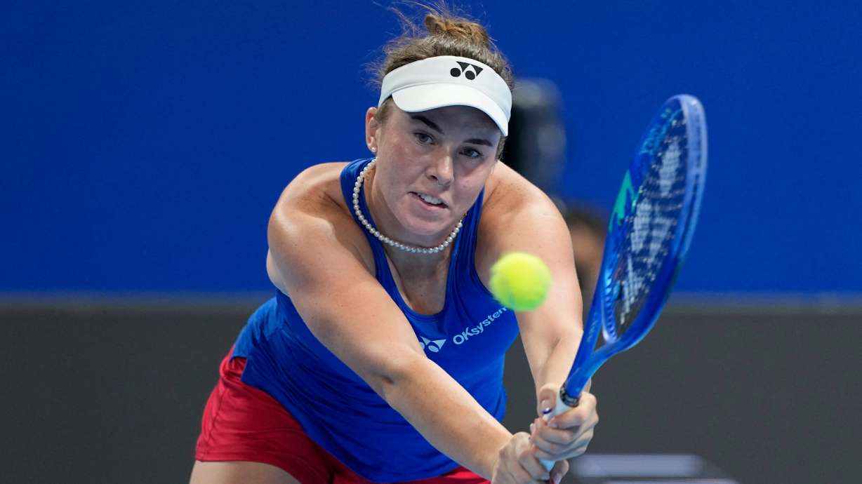 Linda Noskova of Czech Republic returns the ball to Katie Boulter of Britain in a quarterfinal match for the Billie Jean King Cup held in Shenzhen in southern China's Guangdong province, Tuesday, Sept. 22, 2026.