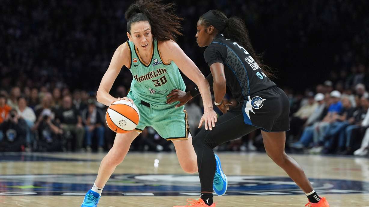 New York Liberty forward Breanna Stewart (30) dribbles downcourt as Minnesota Lynx guard Maya Caldwell (3) defends during the second half of a WNBA basketball game Friday, Sept. 18, 2026, in Minneapolis.