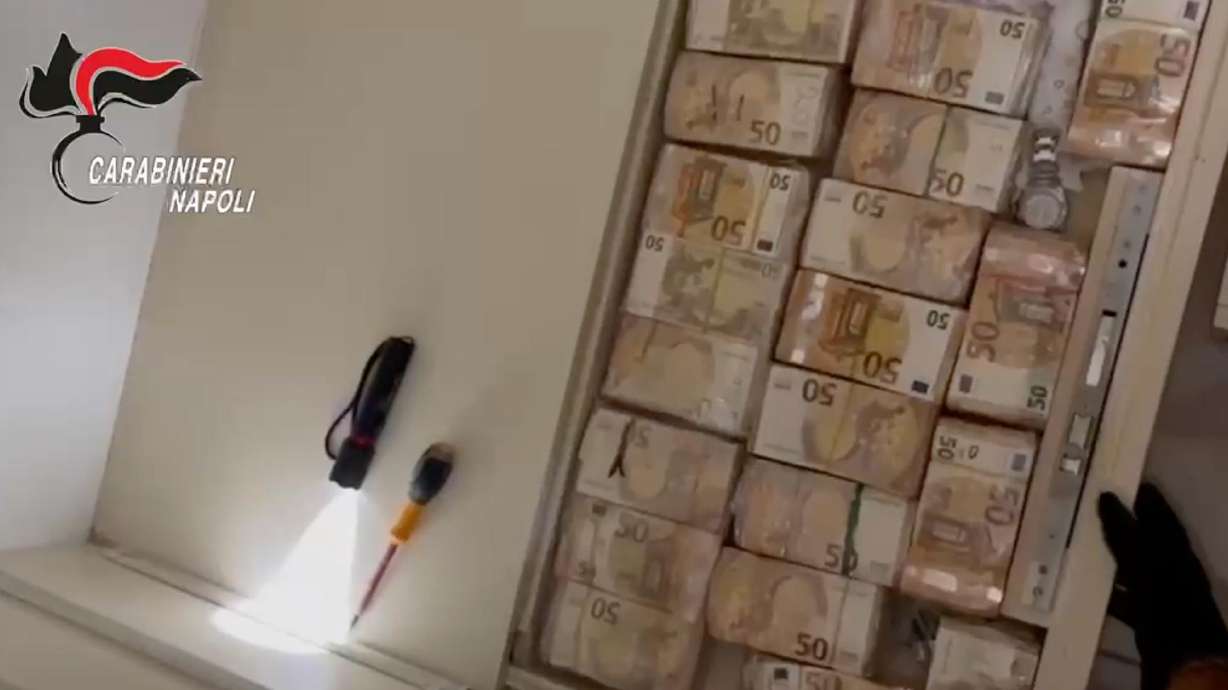 Italian authorities found $3.6 million hidden in the walls, floors and furniture at an apartment in Naples on Monday, in a dawn raid that led to the arrests of 34 people.