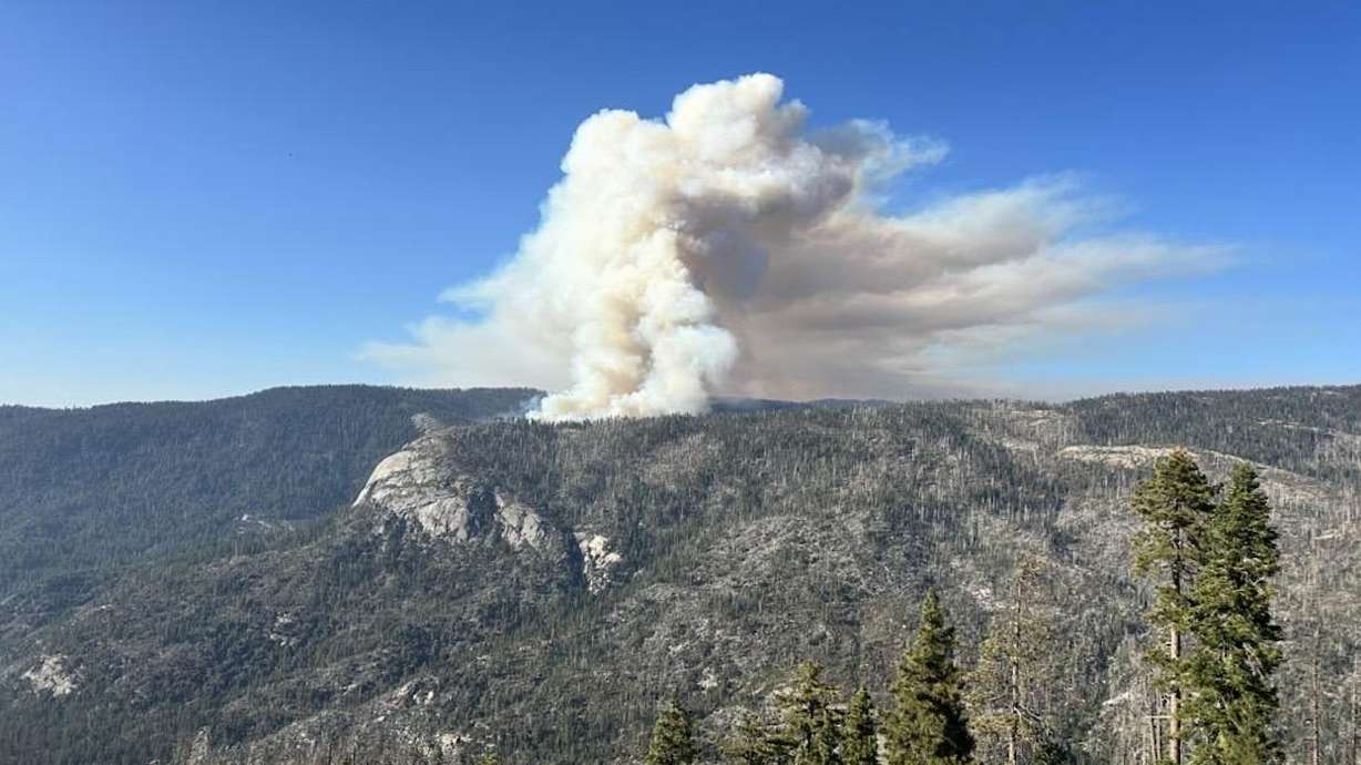 The Dome Fire burning in Yosemite National Park on Wednesday. A contract aircraft company has identified the second pilot killed in the weekend crash of a firefighting helicopter in Yosemite National Park as Ryan Cutter.