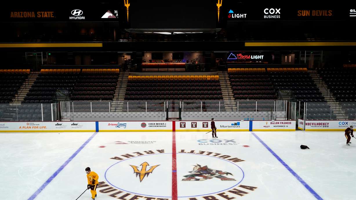 FILE - Members of the Arizona State University hockey team skate on the ice at the new Mullett Arena, Oct. 24, 2022, in Tempe, Ariz.