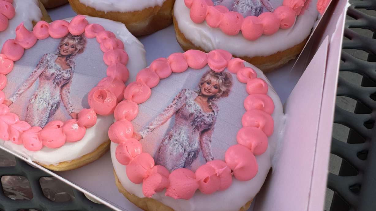 Dolly Parton-themed doughnuts courtesy of Pinkbox are pictured on Tuesday. As multiple cities and businesses plan to celebrate "Dolly Day," Sandy said it was planning to host a free outdoor showing of the movie "Steel Magnolias" to honor the late country star.