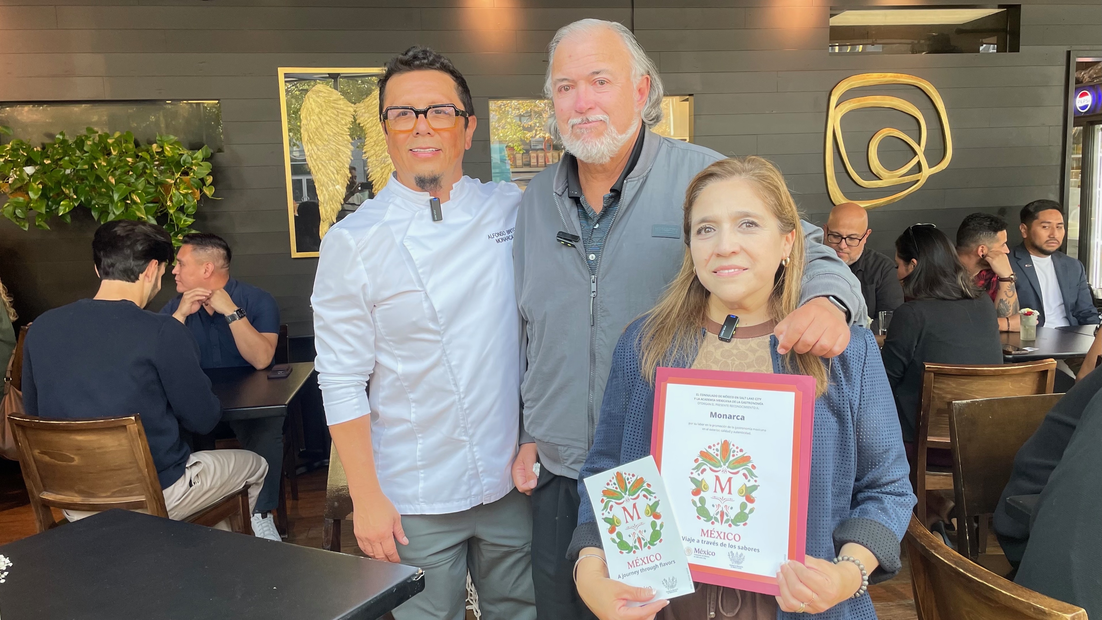 Pictured are Monarca operators Alfonso Brito (left), Claudia Brito (right) and Antonio Cruz Díaz, acting general consul of the Mexican Consulate in Utah. The Mexican restaurant in Salt Lake City received special recognition on Tuesday from the Mexican Consulate for the quality and authenticity of its food.