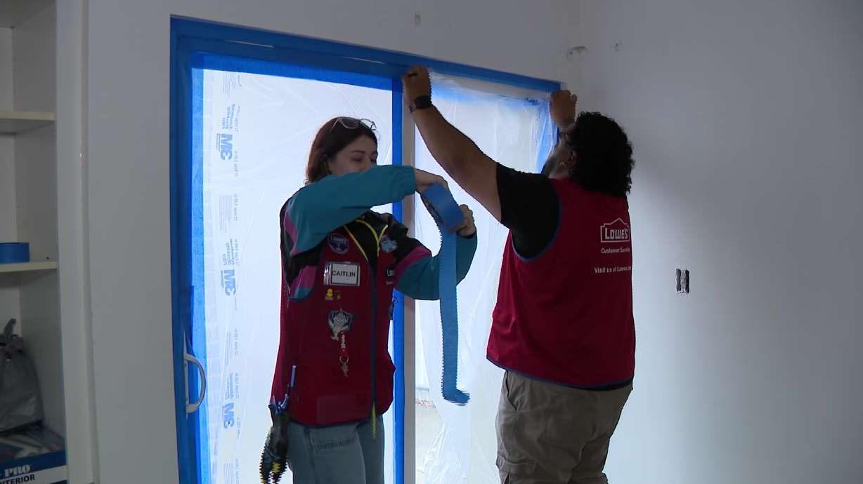 Lowe's employees participate in Red Vest Day at LifeStart village, on Tuesday. Lowe's associates volunteered time and energy to LifeStart Village in Midvale completing improvement projects to support single-parent families who are rebuilding after homelessness.