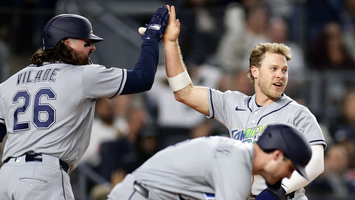 Tampa Bay Rays' Taylor Walls celebrates scoring with Ryan Vilade (26) in the seventh inning during the second baseball game of a doubleheader against the New York Yankees, Tuesday, Sept. 22, 2026, in New York.