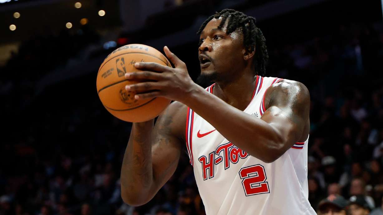 FILE - Houston Rockets forward Dorian Finney-Smith shoots against the Charlotte Hornets during the first half of an NBA basketball game in Charlotte, N.C., Feb. 19, 2026.