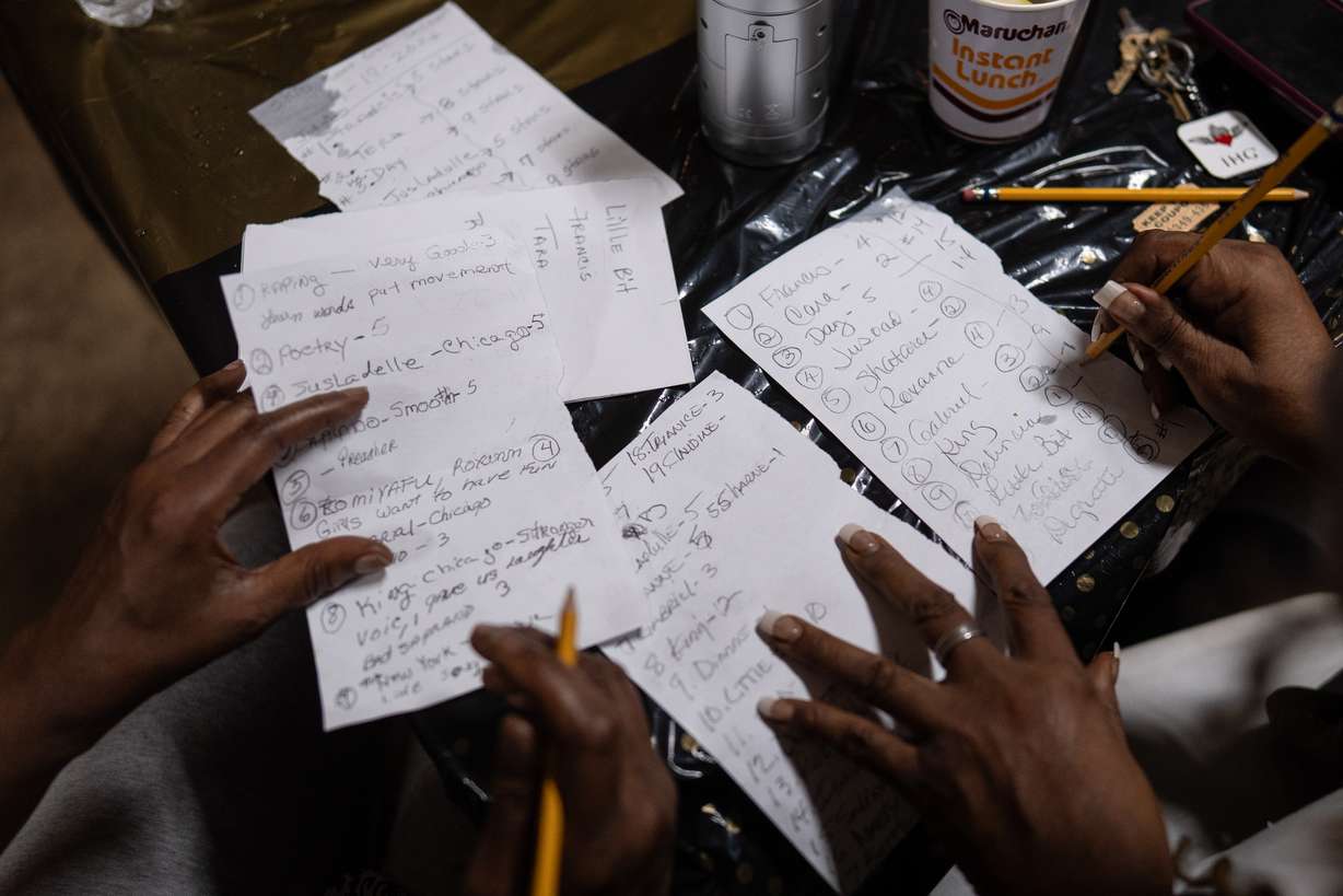 Judges compare notes while deciding the winners of Skid Row's inaugural talent show in downtown Los Angeles, Saturday.