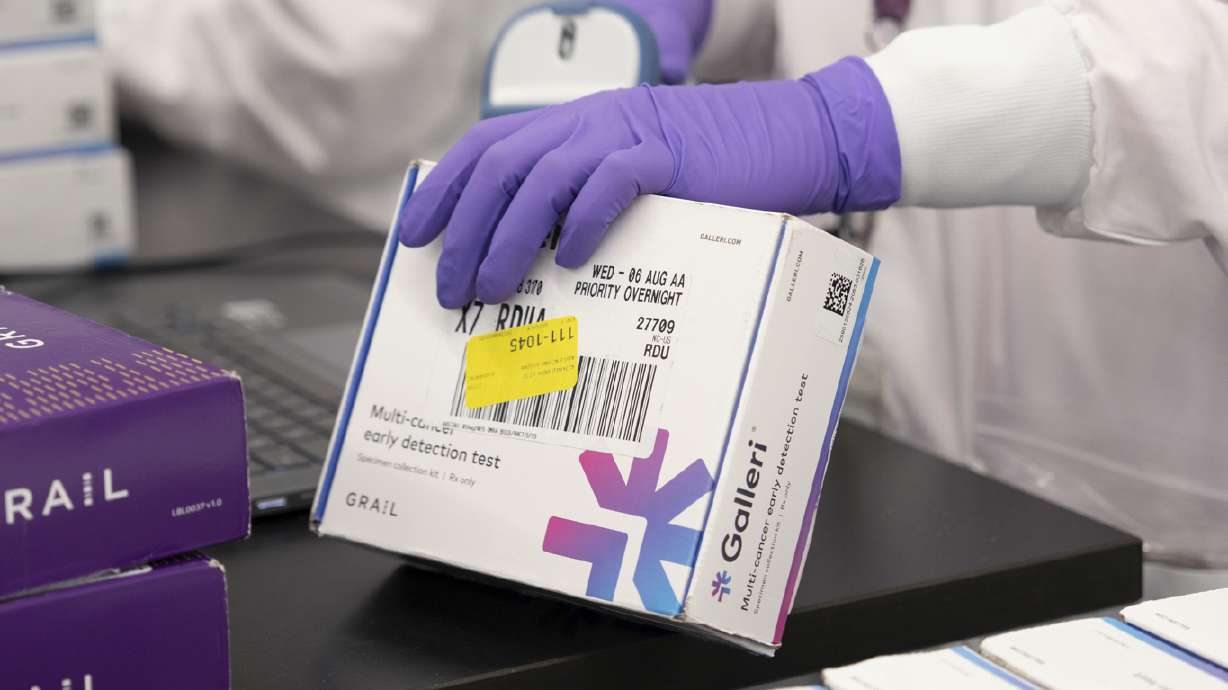 This undated photo provided by Grail Inc. on Tuesday, shows an employee scanning a Galleri cancer screening test.