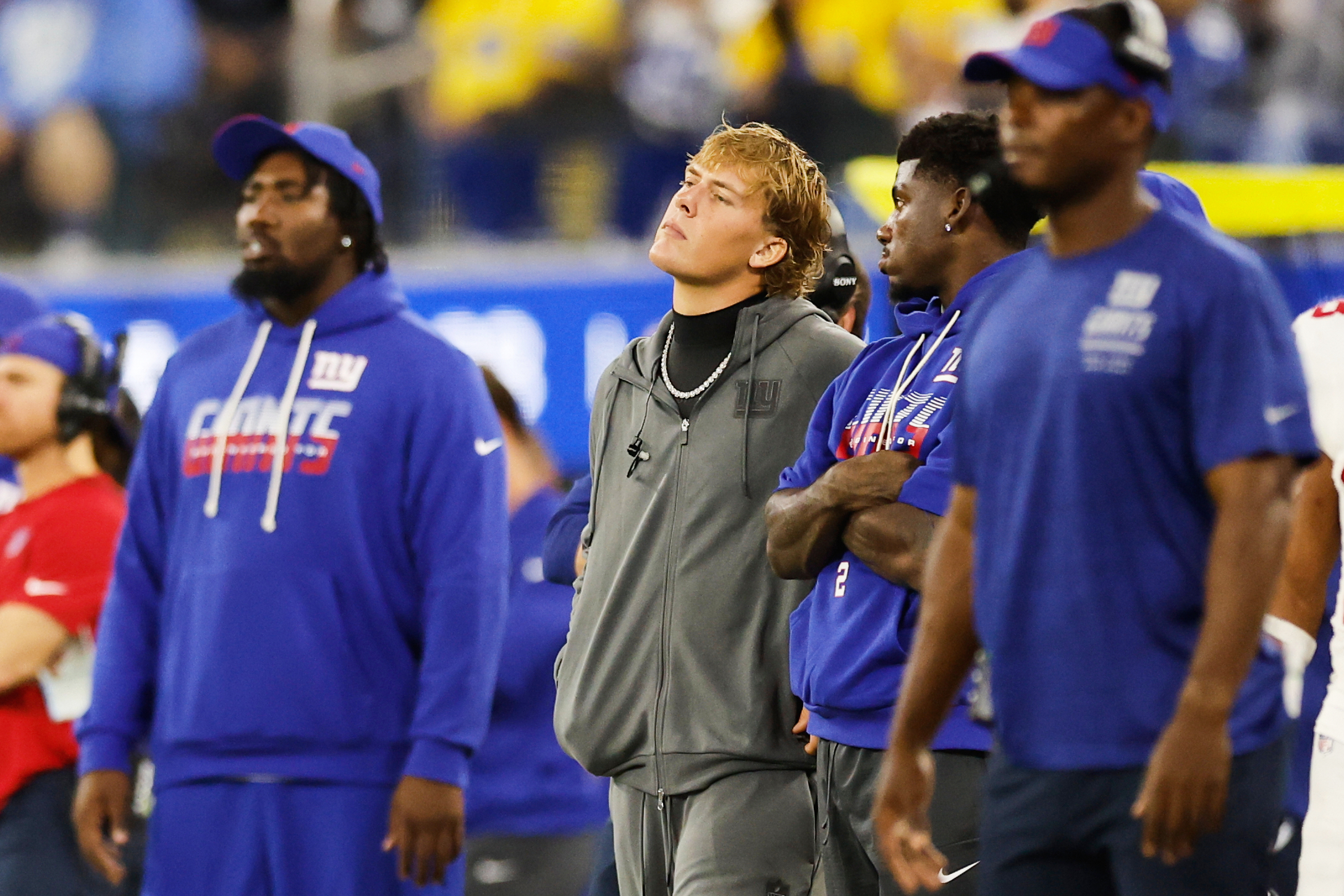 New York Giants quarterback Jaxson Dart, center, watches from the sideline during the second half of an NFL football game against the Los Angeles Rams in Inglewood, Calif., Monday, Sept. 21, 2026. 