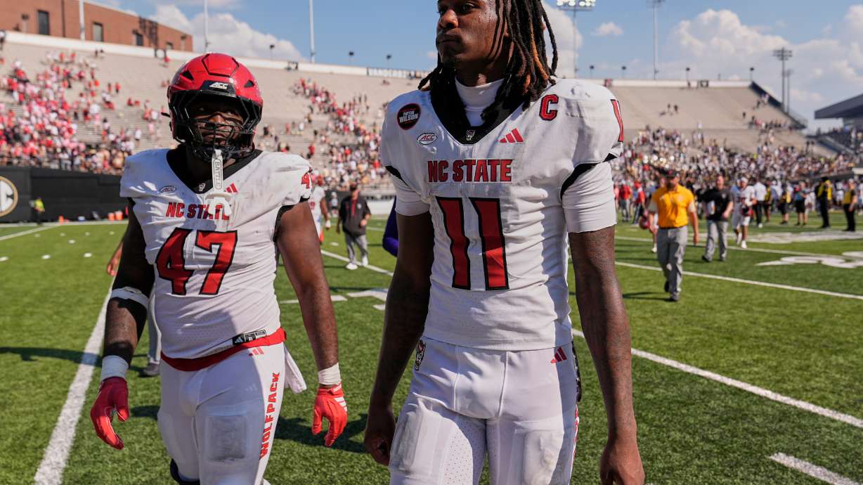 North Carolina State quarterback CJ Bailey (11) walks off the field after the team's loss in an NCAA college football game against Vanderbilt, Saturday, Sept. 19, 2026, in Nashville, Tenn.