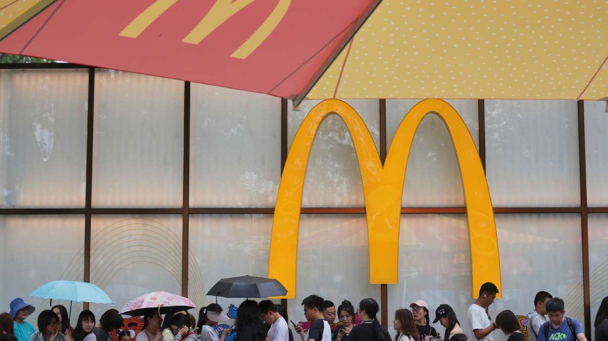 People line up to enter a McDonald's restaurant in Beijing on Aug. 20, 2025. McDonald's said Wednesday it will spend $8.5 billion over the next decade to modernize its restaurants globally.