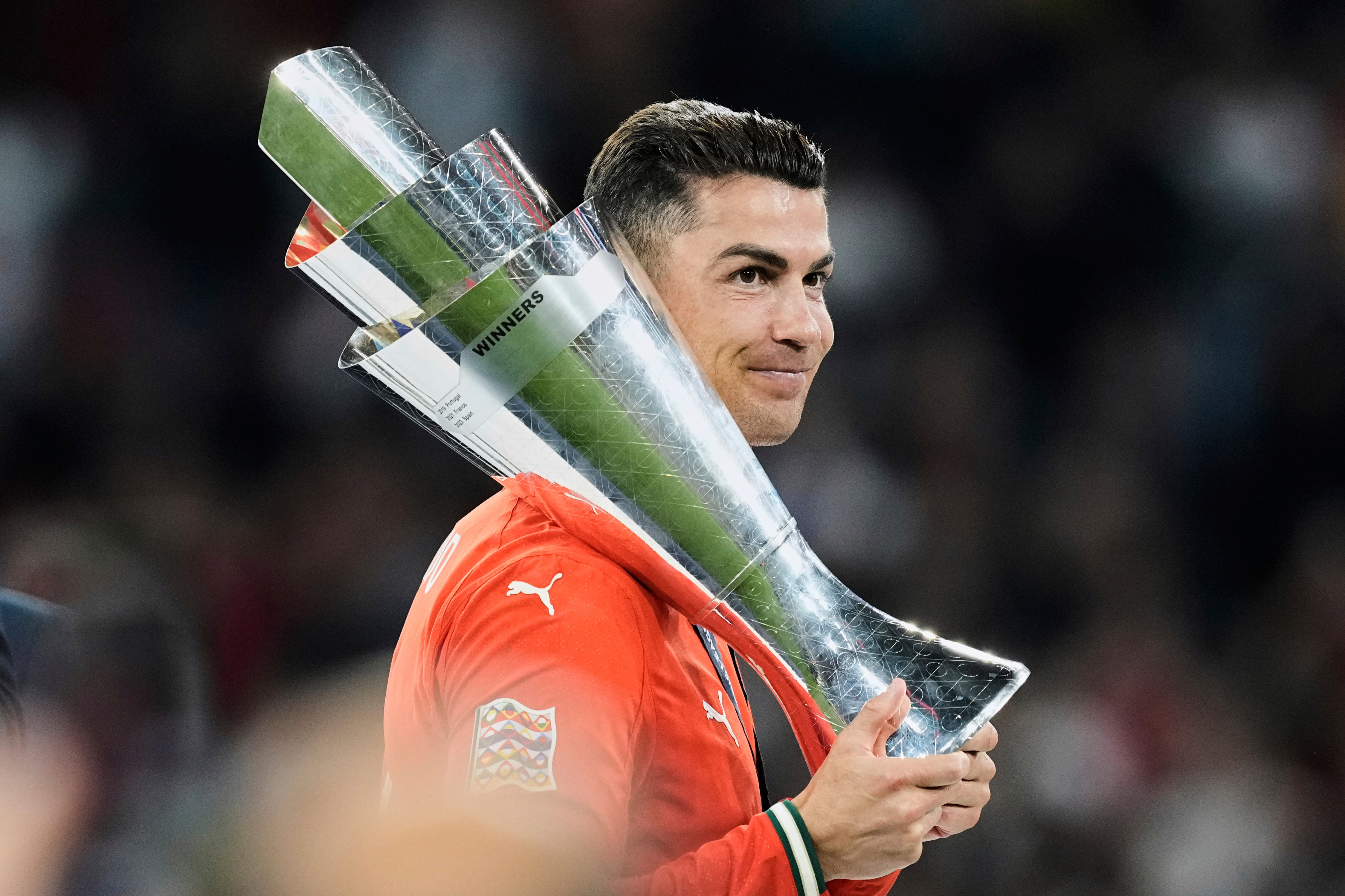 FILE - Portugal's Cristiano Ronaldo holds the trophy after winning the Nations League soccer championship at the Allianz Arena in Munich, Germany, Sunday, June 8, 2025. 