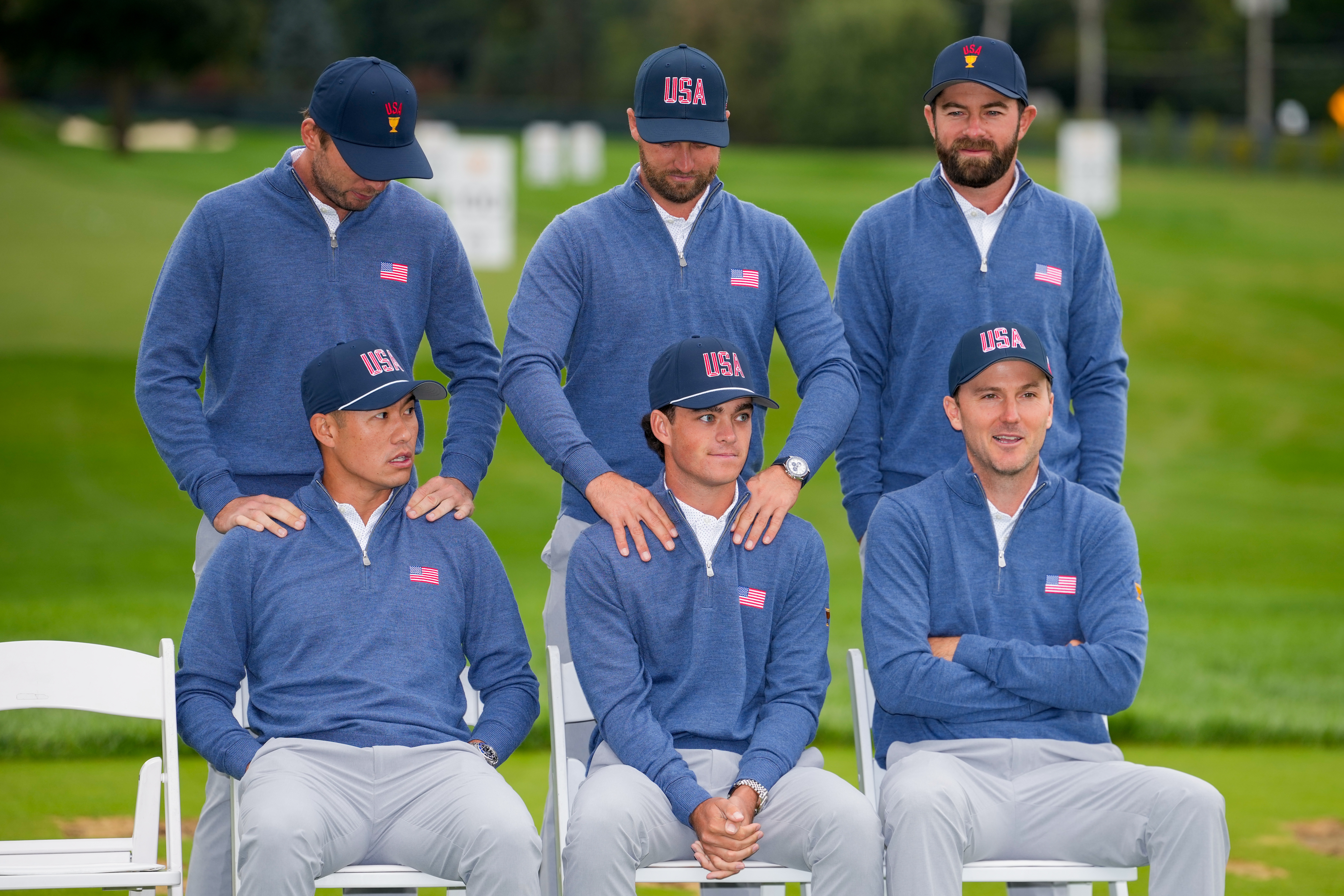 Seated from left; Collin Morikawa, Jackson Koivun and Russell Henley wait with, from left, Sam Burns, Wyndham Clark and Cameron Young for USA teams portrait prior to the start of the Presidents Cup golf tournament at Medinah Country Club, Wednesday, Sept. 23, 2026, in Medinah, Ill. 