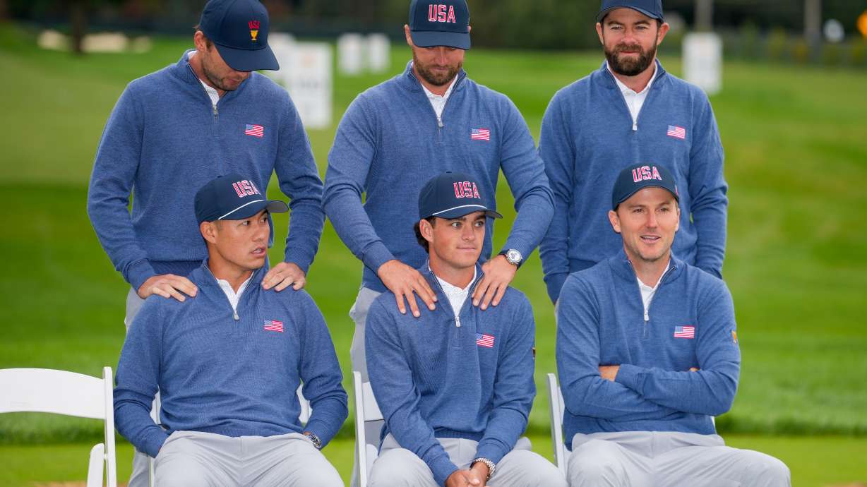 Seated from left; Collin Morikawa, Jackson Koivun and Russell Henley wait with, from left, Sam Burns, Wyndham Clark and Cameron Young for USA teams portrait prior to the start of the Presidents Cup golf tournament at Medinah Country Club, Wednesday, Sept. 23, 2026, in Medinah, Ill.