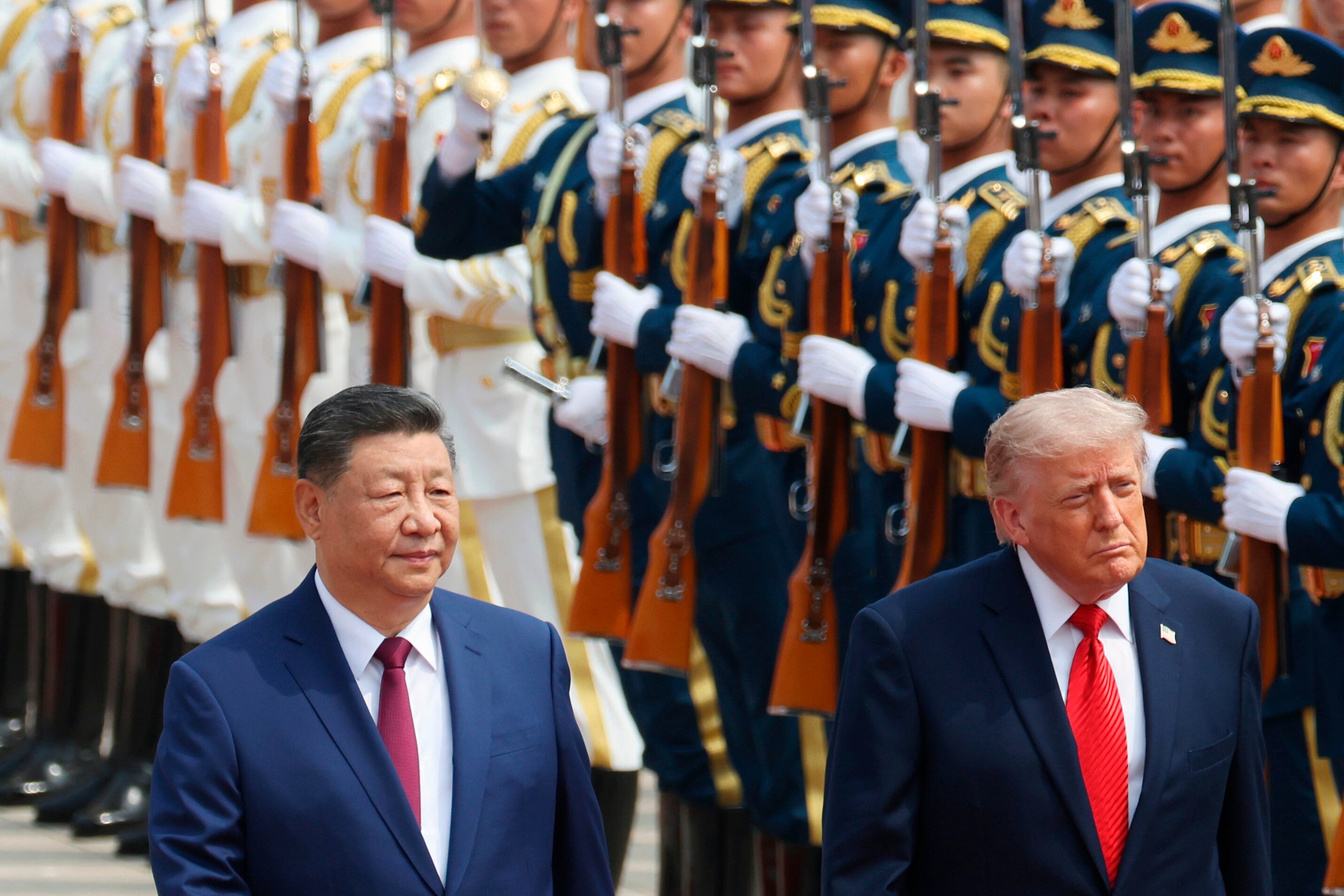 President Donald Trump and Chinese President Xi Jinping review the honor guard during a welcome ceremony at the Great Hall of the People in Beijing, May 14. Taiwan, AI regulation and more are on the agenda for the two leaders.