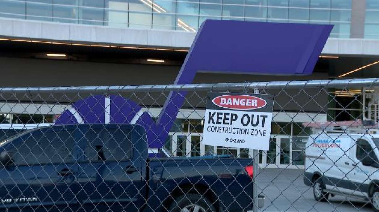 The fence surrounding the Delta Center is pictured on Wednesday. With just days until the Utah Mammoth hosts its first preseason game at the Delta Center, crews are working around the clock to complete the latest phase of the arena's transformation.