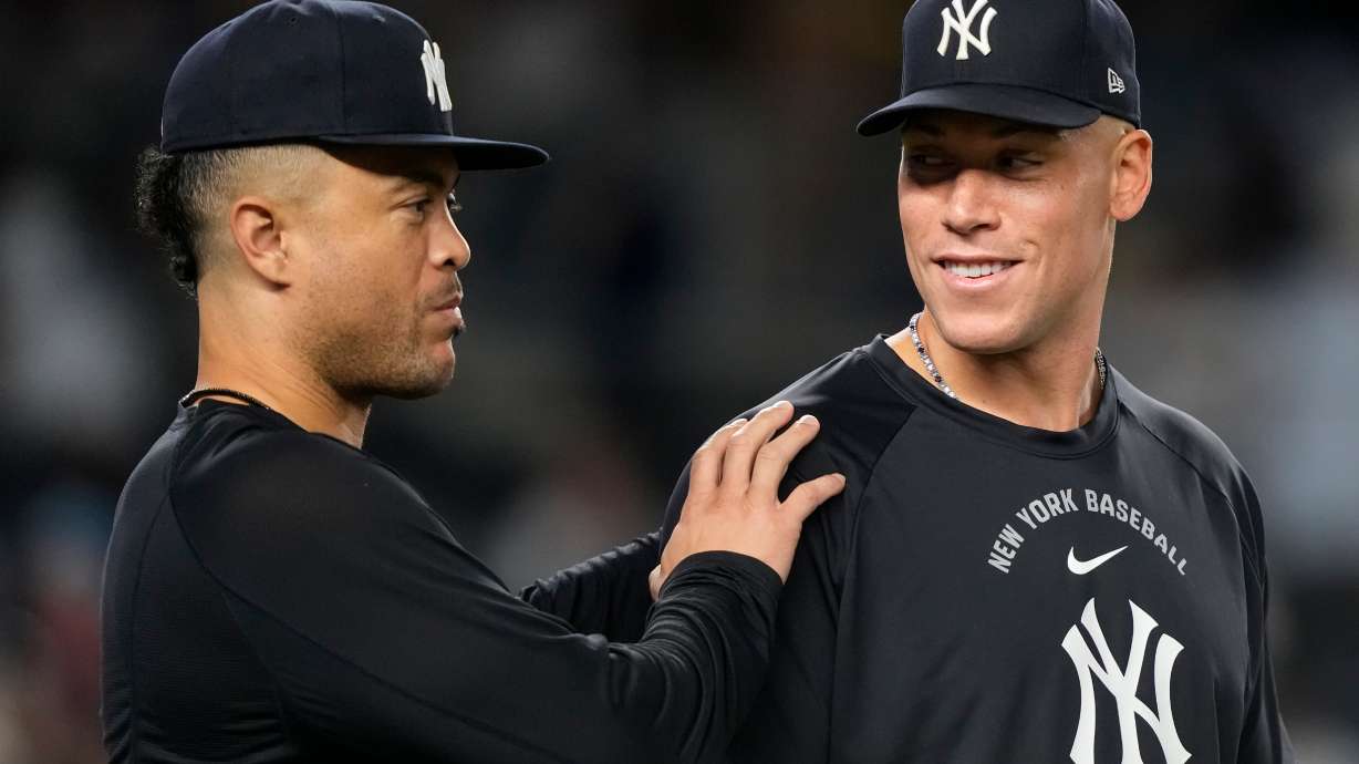 New York Yankees' Aaron Judge, right, and Giancarlo Stanton, left, celebrate after winning a baseball game against the Boston Red Sox, Friday, Aug. 28, 2026, in New York.