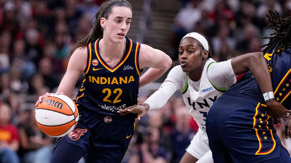 Indiana Fever guard Caitlin Clark (22) drives past Minnesota Lynx guard Maya Caldwell (3) in the second half of a WNBA basketball game in Indianapolis, Tuesday, Sept. 22, 2026.