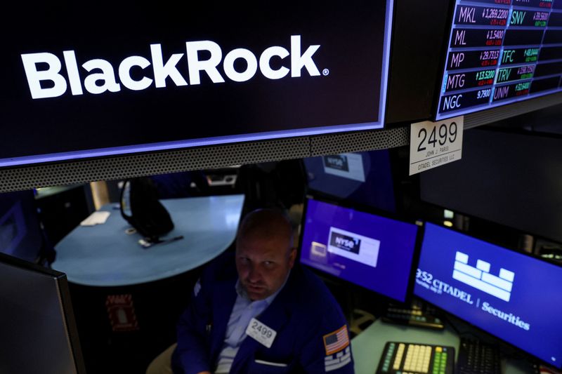 A specialist trader works at the post where BlackRock is traded on the floor of the New York Stock Exchange (NYSE) in New York City, U.S., July 21, 2022.