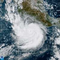 Powerful Hurricane Polo drenches Mexico's coast from offshore as Nolo nears Hawaii