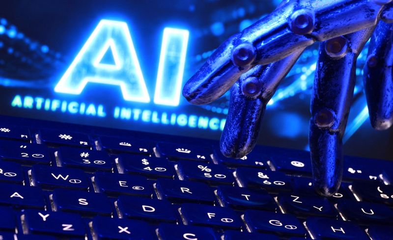 "AI Artificial Intelligence" words, a keyboard and a robotics hand in this illustration taken, September 23, 2026.