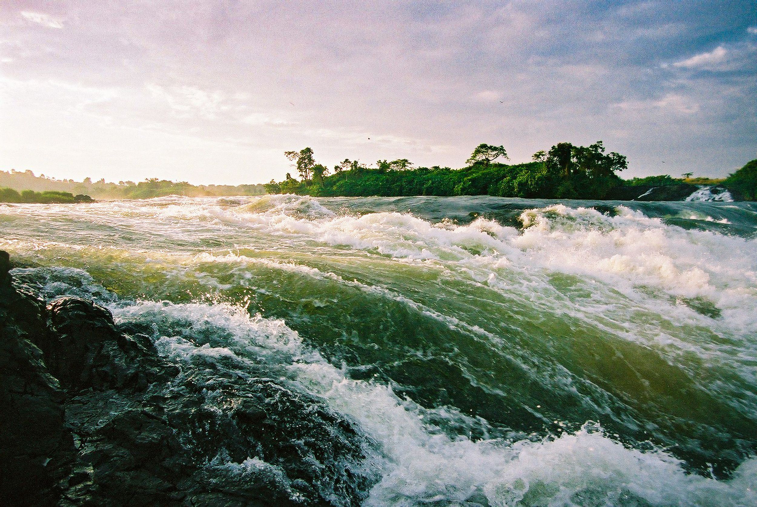 The rapids of the River Nile at the source out of Lake Victoria at Jinja Town, Uganda at sunrise.