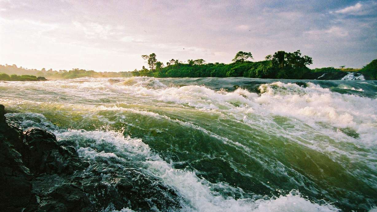The rapids of the River Nile at the source out of Lake Victoria at Jinja Town, Uganda at sunrise.
