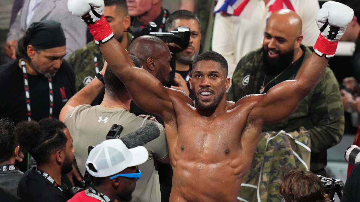 FILE - Anthony Joshua reacts after defeating Jake Paul in their heavyweight boxing match, Friday, Dec. 19, 2025, in Miami.