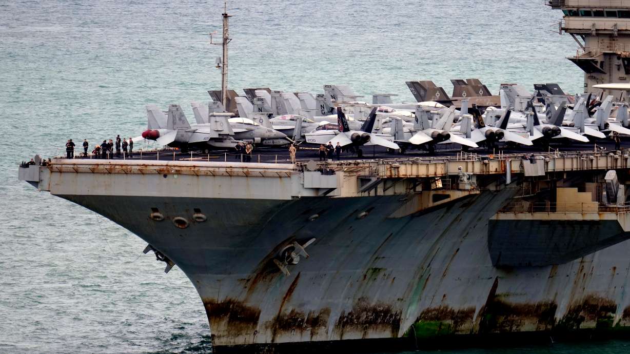 The U.S. Navy aircraft carrier USS Abraham Lincoln arrives at the port in Laem Chabang, Chonburi, Thailand, Sept. 2. This week the Navy said eight sailors from the USS Abraham Lincoln aircraft carrier strike group attempted suicide during an extended deployment.