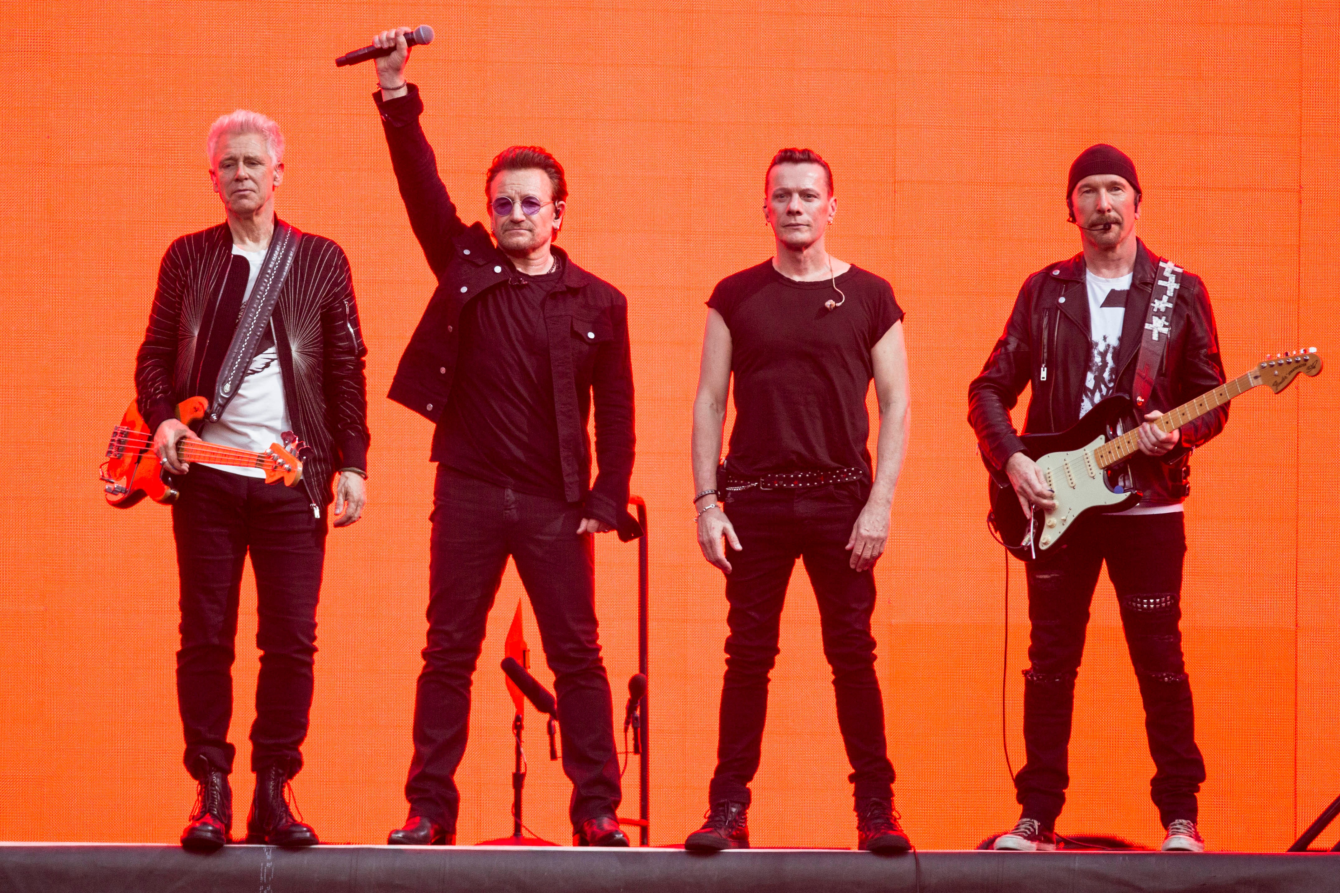 Adam Clayton, from left, Bono, Larry Mullen Jr. and The Edge, of the band U2, perform on stage at Twickenham Stadium in London on July 9, 2017.