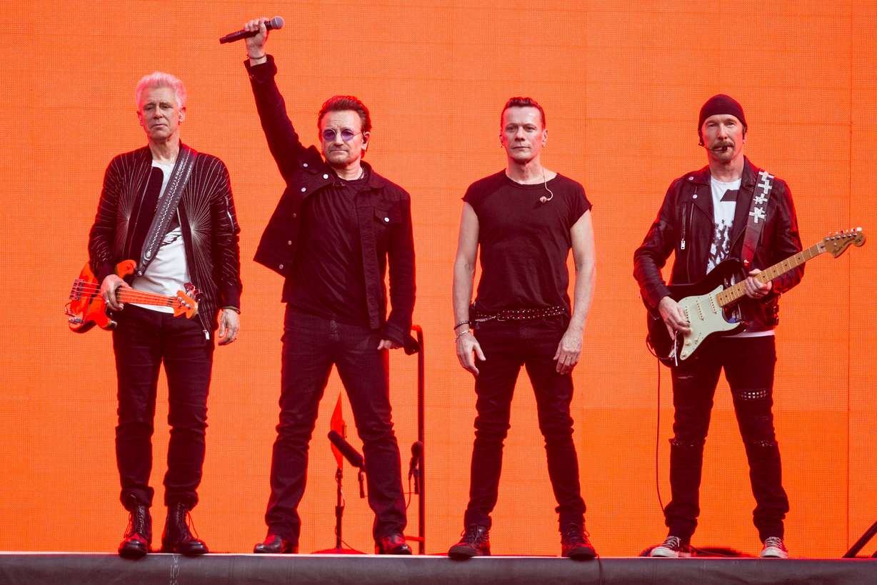 Adam Clayton, from left, Bono, Larry Mullen Jr. and The Edge, of the band U2, perform on stage at Twickenham Stadium in London on July 9, 2017.