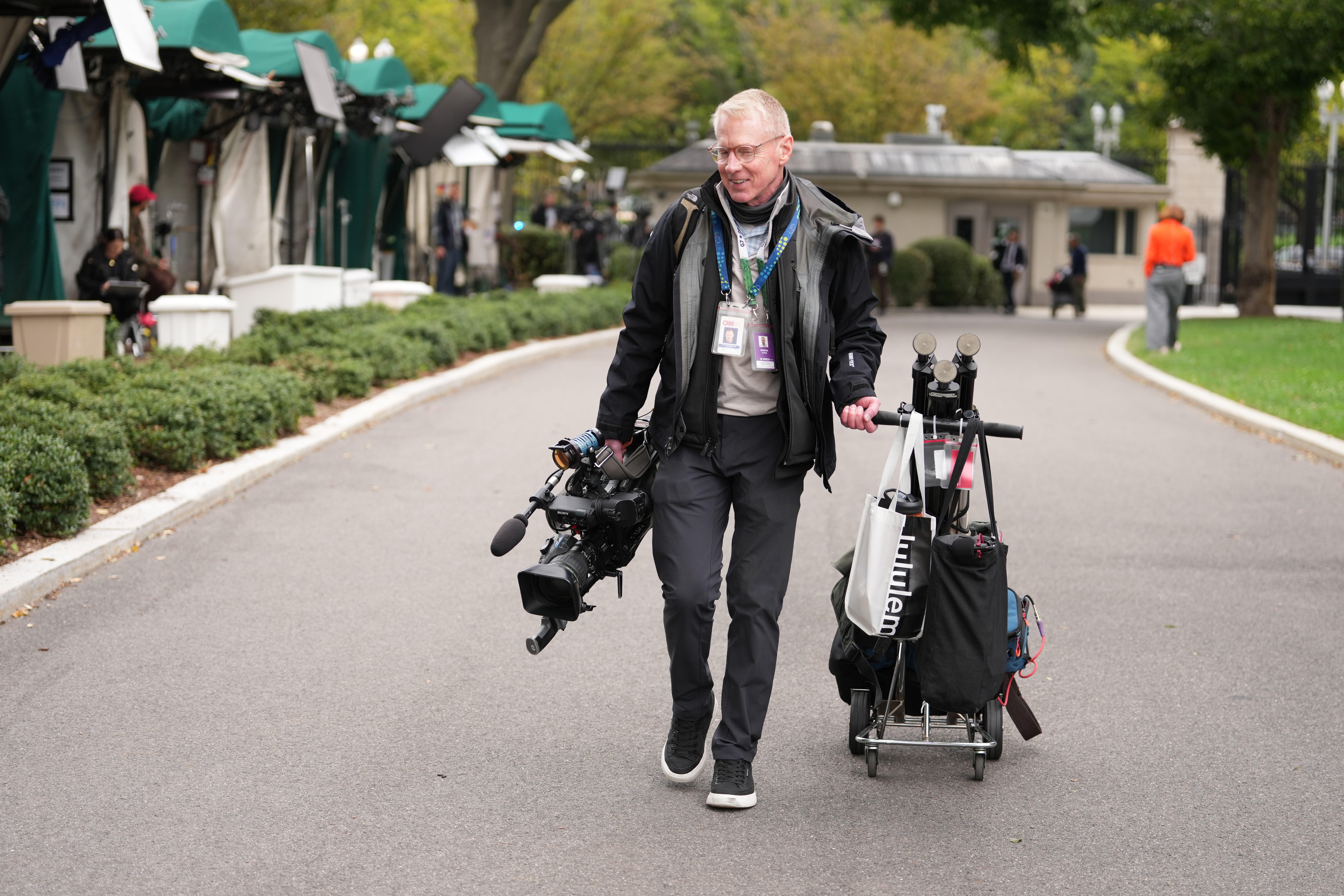 CNN senior photojournalist and contributing producer Peter Morris, arrives on the White House grounds, Thursday, in Washington. The network, along with MS NOW and Politico, had access to the White House restored following a judge's order.