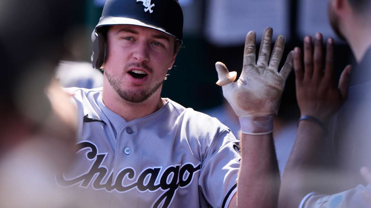 Chicago White Sox's Kyle Teel celebrates in the dugout after scoring on a sacrifice fly hit by Andrew Benintendi during the first inning of a baseball game against the Kansas City Royals, Thursday, Sept. 24, 2026, in Kansas City, Mo.