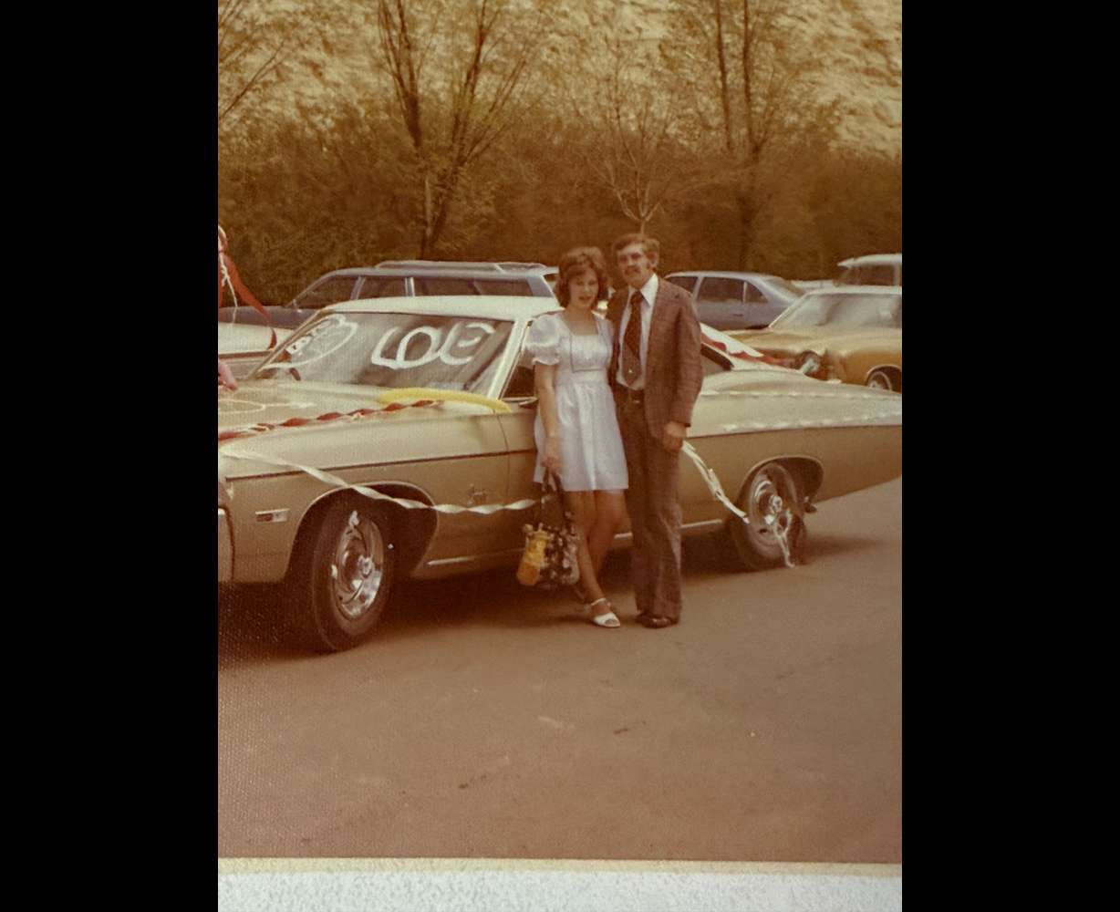 Gloria and Richard Gratton were engaged in 1974 in front of a historic 7-up sign that has recently been uncovered on Main Street in Cedar City.