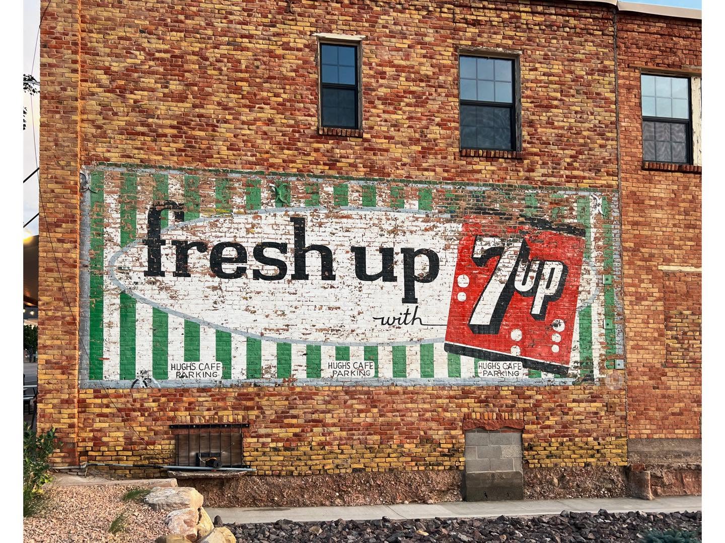 Gloria and Richard Gratton were engaged in 1974 in front of a historic 7-up sign that has recently been uncovered on Main Street in Cedar City.