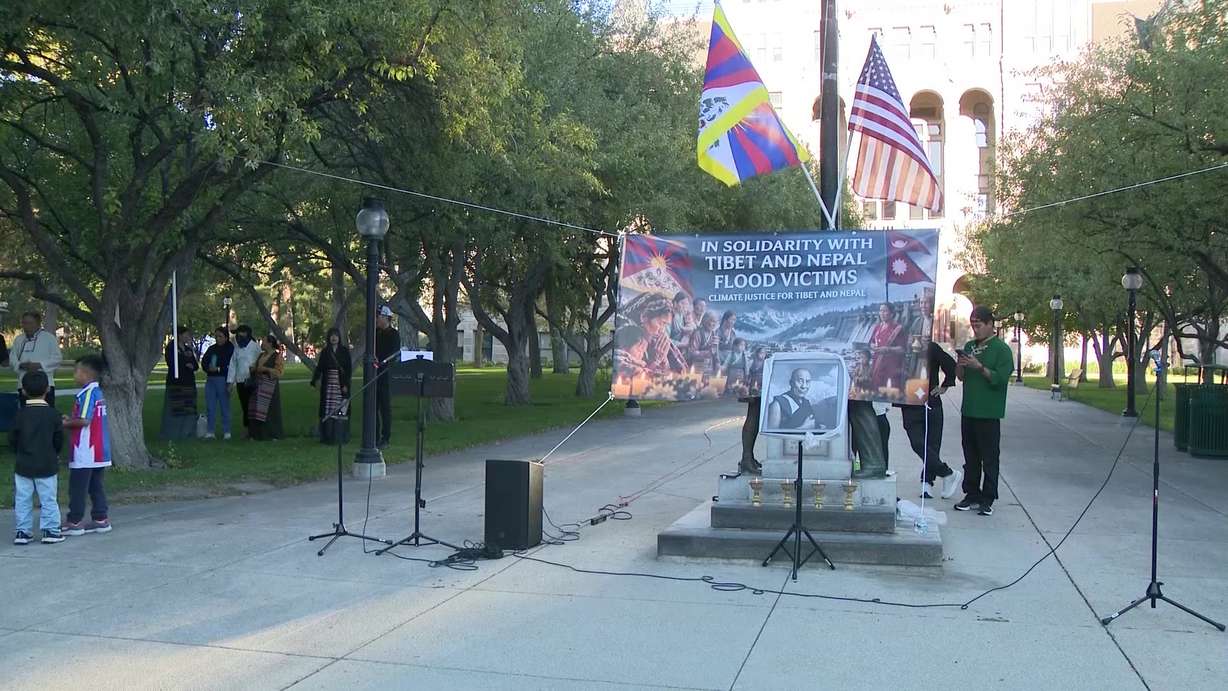 Participants at the Solidarity Candlelight Vigil held Wednesday night at Salt Lake City Hall. It honored those impacted by recent flooding in Tibet and Nepal.