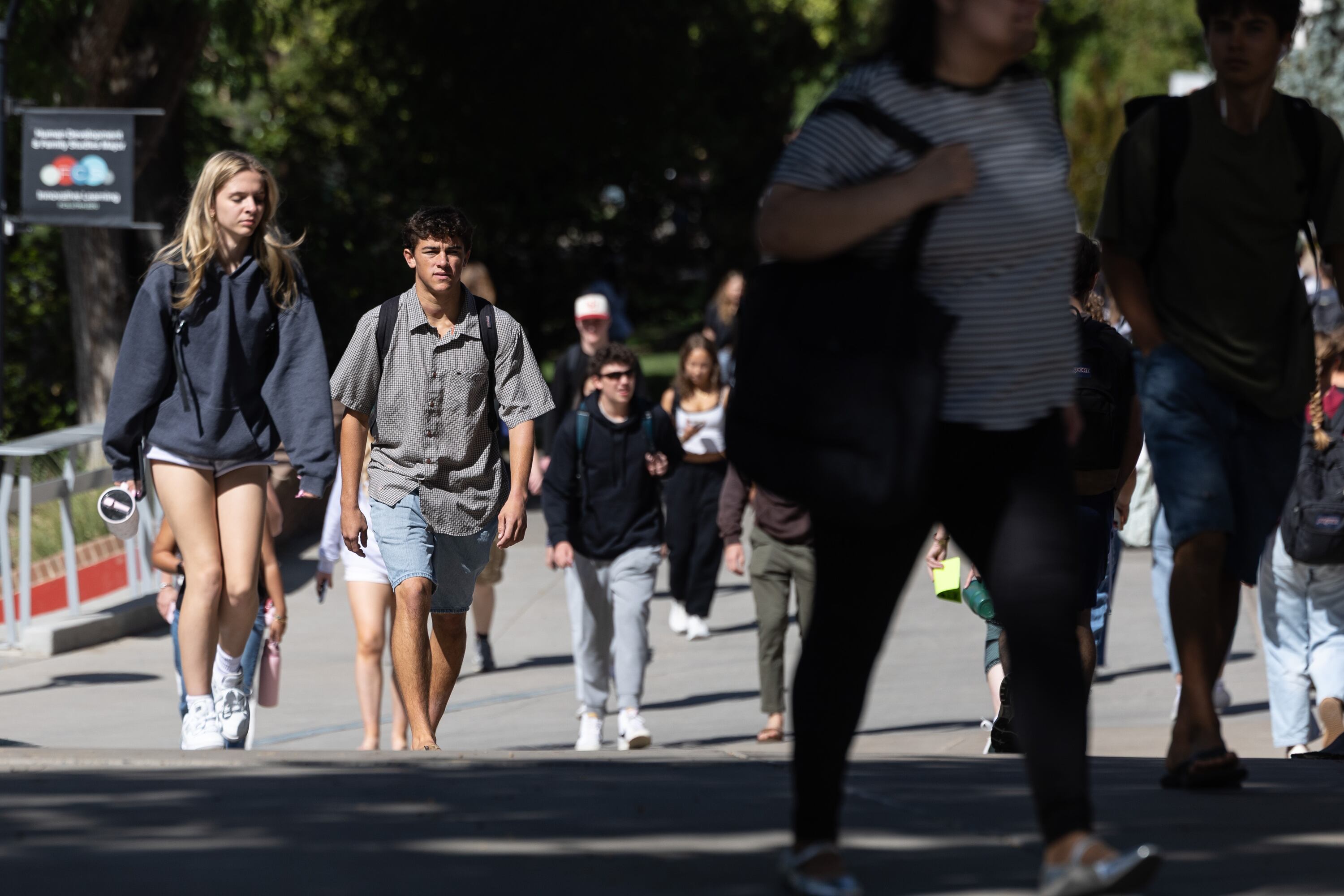 Students walk across campus at the University of Utah in Salt Lake City on Sept. 14. The school is criticizing a proposed rule by the Trump administration to attach substantial fees for international students in Optional Practical Training.