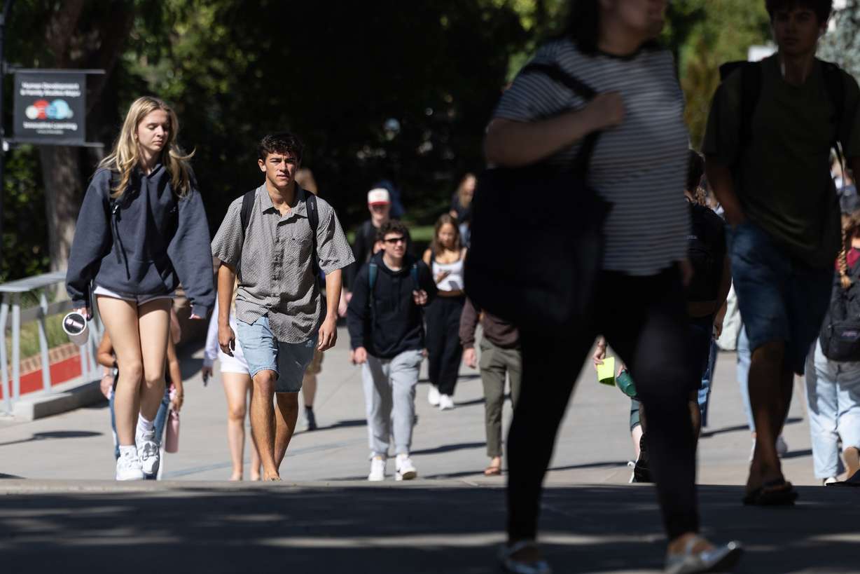 Students walk across campus at the University of Utah in Salt Lake City on Sept. 14. The school is criticizing a proposed rule by the Trump administration to attach substantial fees for international students in Optional Practical Training.