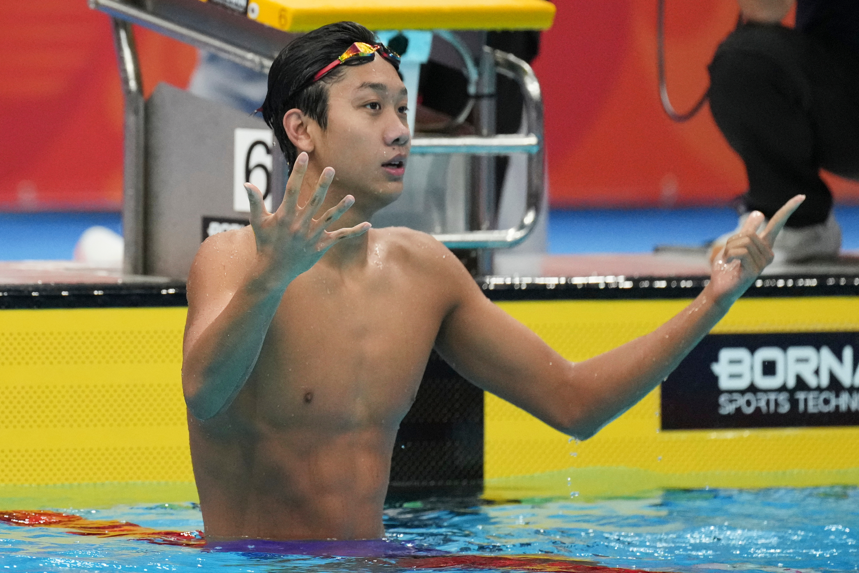 Zhang Zhanshuo of China reacts after winning the men's 400m freestyle swimming final at the Asian Games in Tokyo, Japan, Friday, Sept. 25, 2026. 