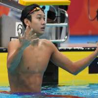Chinese swimmer Zhang Zhanshuo completes sweep of seven gold medals at the Asian Games