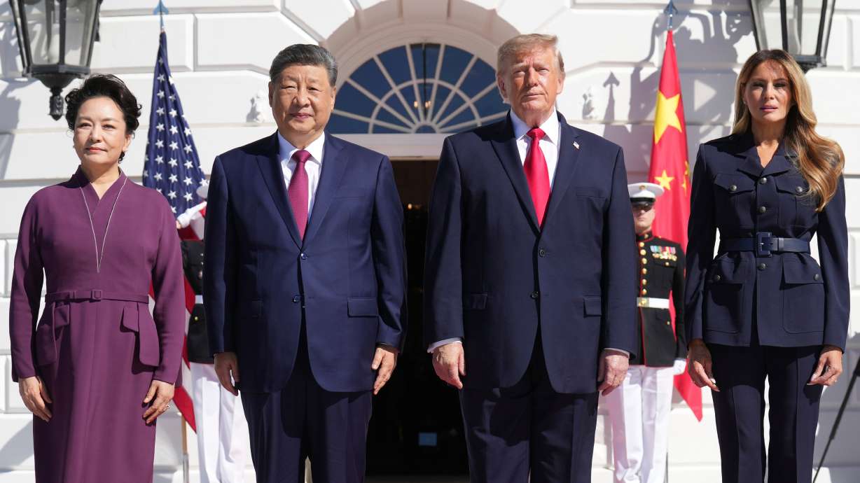 President Donald Trump and first lady Melania Trump as they greet China's President Xi Jinping and his wife Peng Liyuan as they arrive at the South Portico of the White House for tea, Friday, in Washington. Xi told Trump he expects to meet him twice more this year.